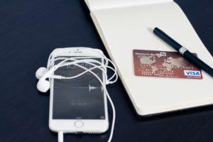 Surchargingb2bCreditCardPayments phone w/ headphones