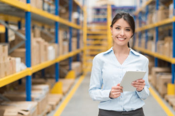 Business woman working at a warehouse