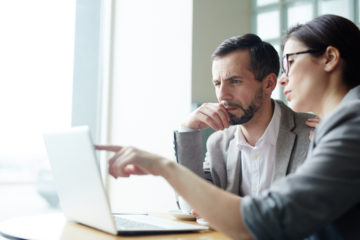 woman and man on computer